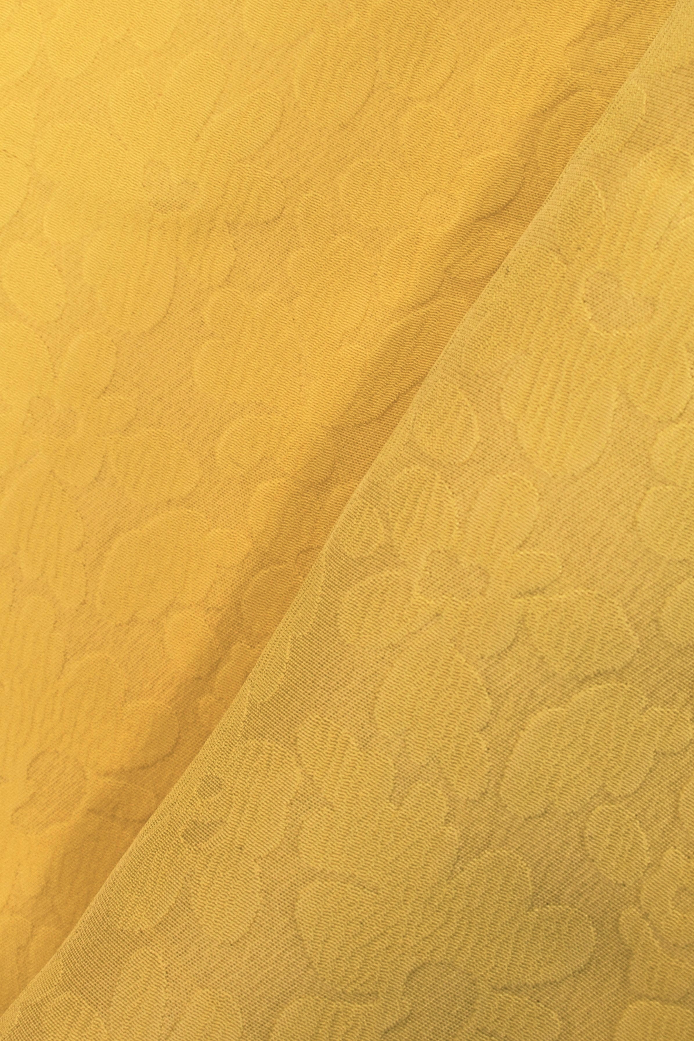 Yellow viscose devorè fabric with raised floral pattern