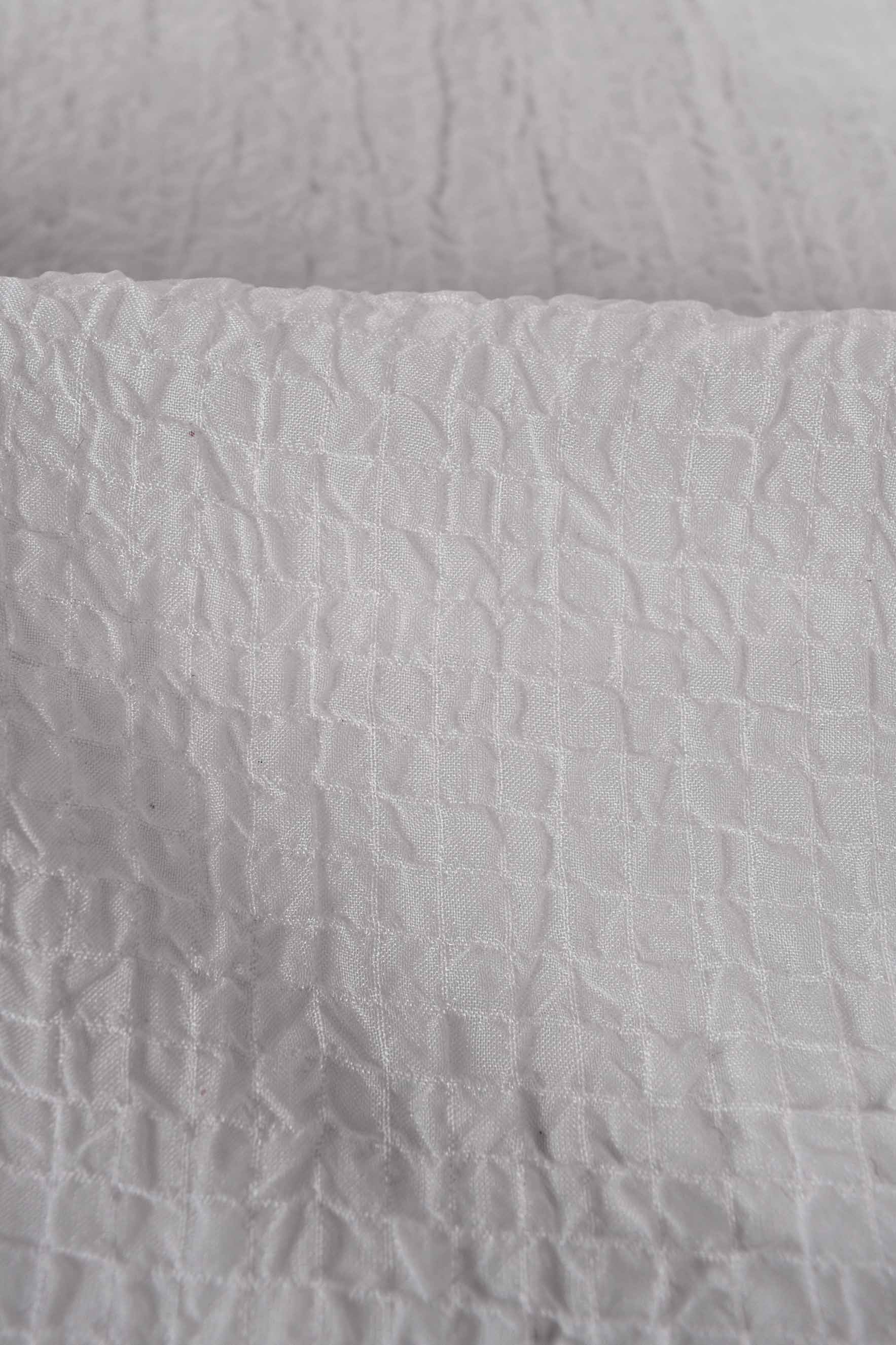 Tessuto goffrato bianco