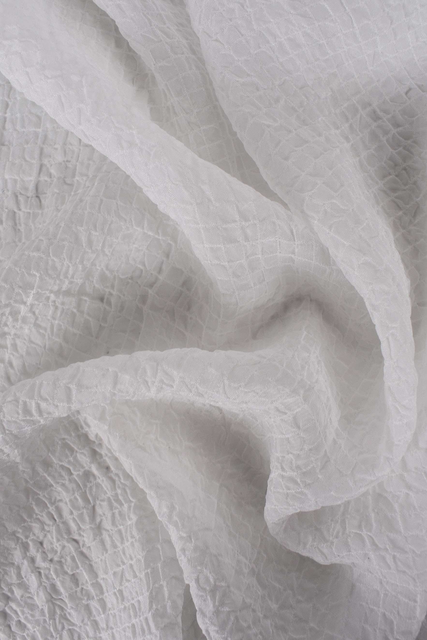 Tessuto goffrato bianco